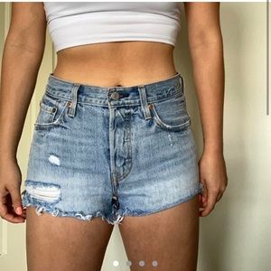 Levi’s light wash denim shorts distressed
